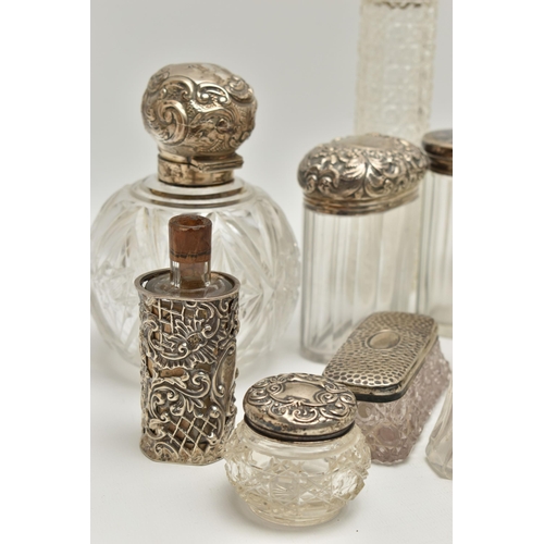 5 - A BOX OF ASSORTED SILVER LIDDED VANITY JARS, to include two round glass bottles, one with an embosse... 