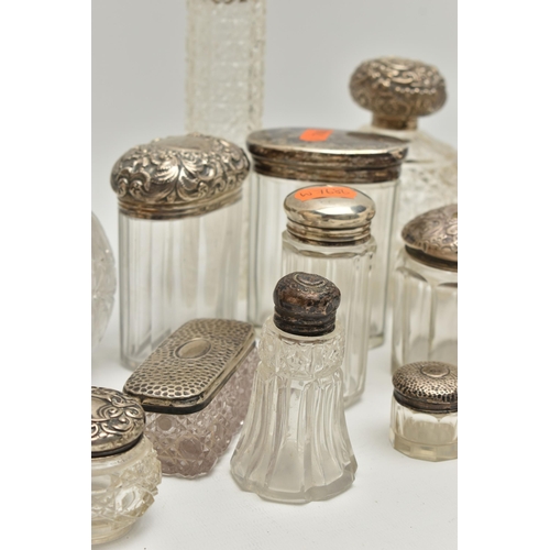 5 - A BOX OF ASSORTED SILVER LIDDED VANITY JARS, to include two round glass bottles, one with an embosse... 