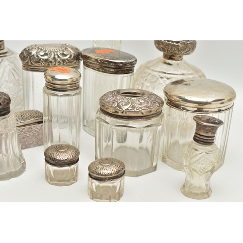 5 - A BOX OF ASSORTED SILVER LIDDED VANITY JARS, to include two round glass bottles, one with an embosse... 