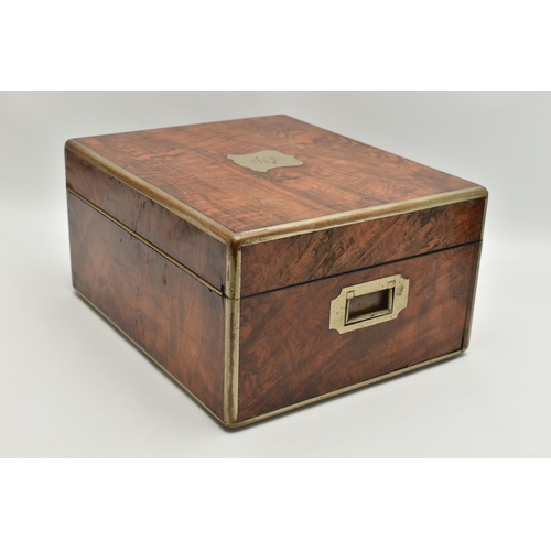 7 - A VICTORIAN FIGURED WALNUT AND PLATED METAL BOUND TOILET BOX, the hinged lid with shield cartouche e... 