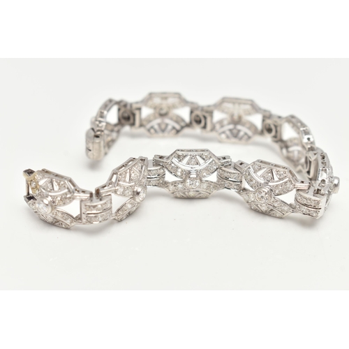 33 - AN ART DECO STYLE DIAMOND BRACELET, nine white metal panels, each set with a single bezel set round ... 