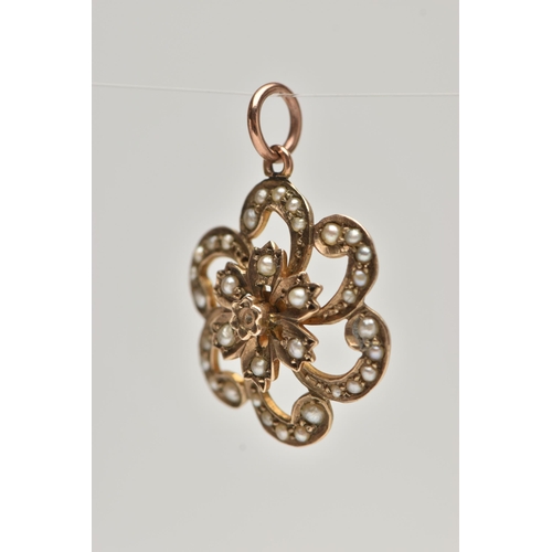 44 - A EARLY 20TH CENTURY 9CT GOLD PENDANT, a yellow gold floral open work pendant, set with seed pearls,... 