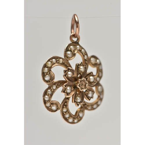 44 - A EARLY 20TH CENTURY 9CT GOLD PENDANT, a yellow gold floral open work pendant, set with seed pearls,... 