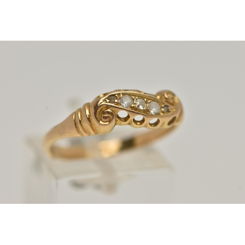 47 - A YELLOW METAL DIAMOND RING, set with five graduated diamonds, within a scroll mount, leading onto a... 