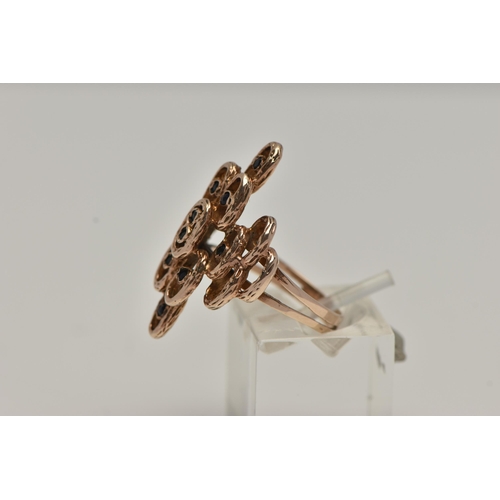 50 - A 9CT GOLD ABSTRACT RING, rose gold open work design, textured detail set with ten circular cut sapp... 