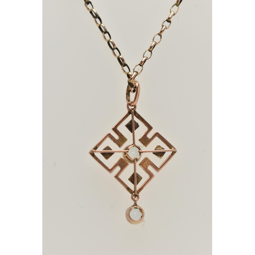 59 - AN EARLY 20TH CENTURY ART DECO PENDANT, a rose gold quatrefoil open work pendant, principally set wi... 