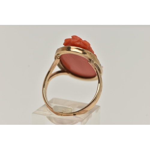 60 - A CARVED CORAL RING, a cameo ring depicting a lady with flowers in her hair, collect set in rose met... 