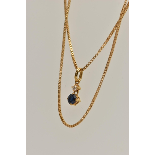 63 - AN 18CT GOLD TWO STONE PENDANT, a round brilliant cut diamond and a circular cut sapphire prong set ... 