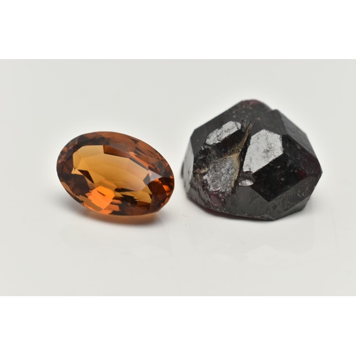 70 - TWO LOOSE GEMSTONES, to include a loose oval cut citrine and a rough garnet