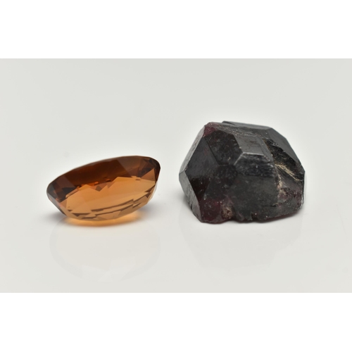 70 - TWO LOOSE GEMSTONES, to include a loose oval cut citrine and a rough garnet