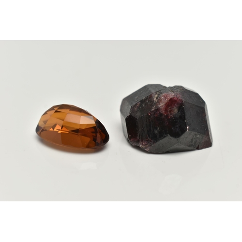 70 - TWO LOOSE GEMSTONES, to include a loose oval cut citrine and a rough garnet