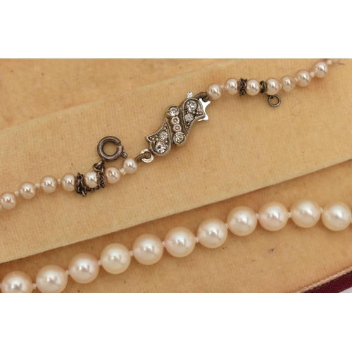 73 - A CULTURED PEARL NECKLACE AND AN IMITATION PEARL NECKLACE, the first a single row of individually kn... 