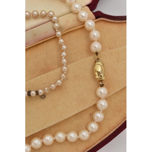 73 - A CULTURED PEARL NECKLACE AND AN IMITATION PEARL NECKLACE, the first a single row of individually kn... 