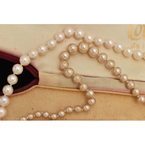 73 - A CULTURED PEARL NECKLACE AND AN IMITATION PEARL NECKLACE, the first a single row of individually kn... 