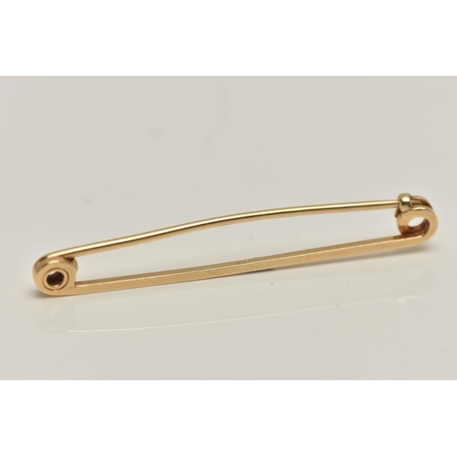 79 - A YELLOW METAL BAR BROOCH, polished bar, fitted with a brooch pin and C clasp, stamped 14k, length 5... 