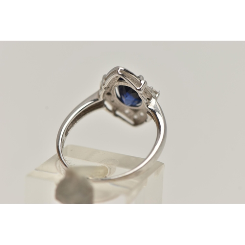 81 - A WHITE METAL RING AND EARRINGS, the ring of a marquise shape, set with an oval cut synthetic blue s... 