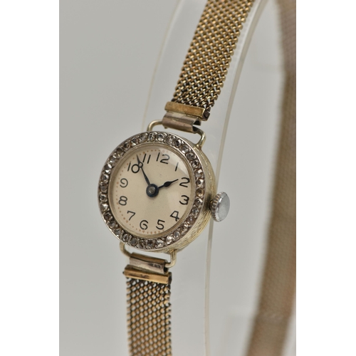 84 - AN EARLY 20TH CENTURY LADYS 18CT GOLD AND DIAMOND WRISTWATCH, manual wind, round white dial, Arabic ... 