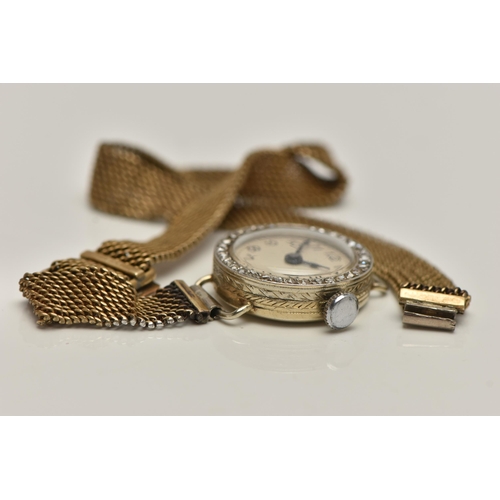 84 - AN EARLY 20TH CENTURY LADYS 18CT GOLD AND DIAMOND WRISTWATCH, manual wind, round white dial, Arabic ... 