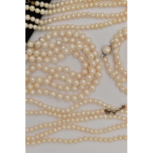 86 - AN ASSORTMENT OF CULTURED PEARL NECKLACES, to include a single row of individually knotted cream pea... 