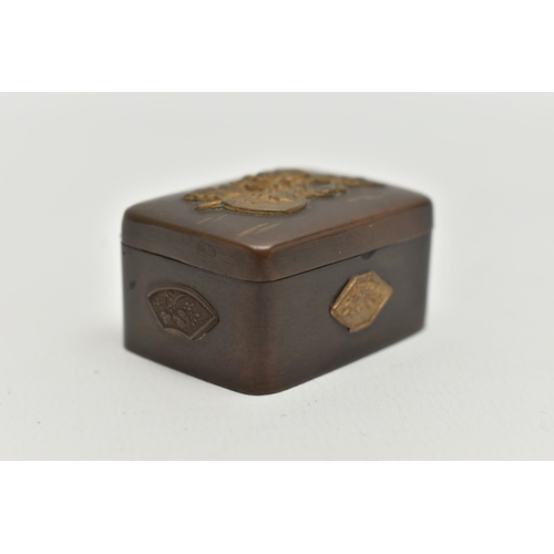 103 - A JAPANESE MEIJI PERIOD BRONZED AND GILT METAL PILL BOX, gilt relief decoration to top and sides, hi... 