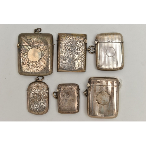 111 - SIX EDWARDIAN AND GEORGE V SILVER RECTANGULAR VESTA CASES, two engine turned and four foliate engrav... 