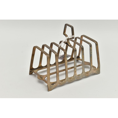 112 - A GEORGE V SILVER SEVEN BAR TOAST RACK OF RECTANGULAR FORM, stamped serial no H8618 to underside, ma... 