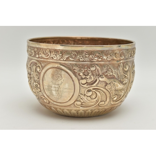 116 - A MID 20TH CENTURY SILVER EMBOSSED BOWL, embossed floral and foliage pattern with vacant cartouche, ... 