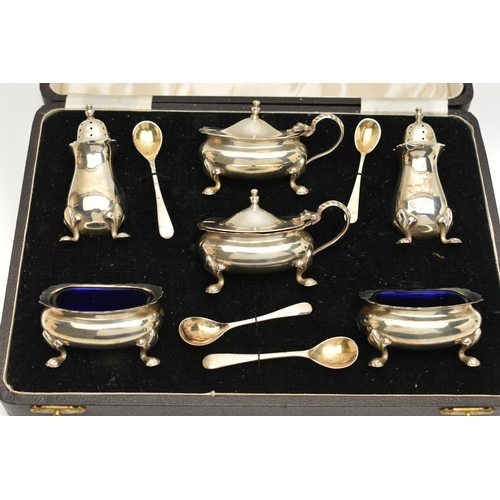 122 - A MID 20TH CENTURY SILVER CASED 'SYNYER & BEDDOES' CREUT SET, comprising of two salts with blue glas... 