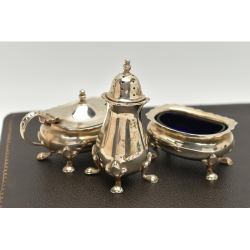 122 - A MID 20TH CENTURY SILVER CASED 'SYNYER & BEDDOES' CREUT SET, comprising of two salts with blue glas... 