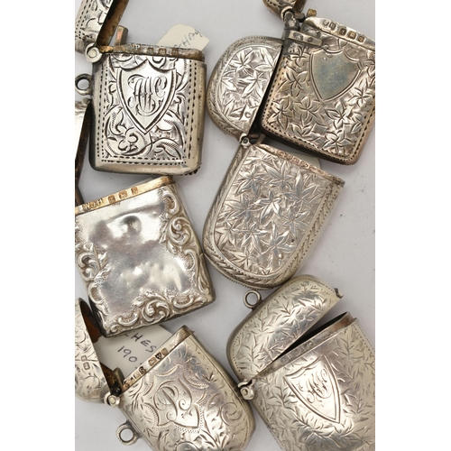 124 - SIX SILVER VESTA CASES, five with engraved floral or foliage patterns, and an embossed floral vesta,... 