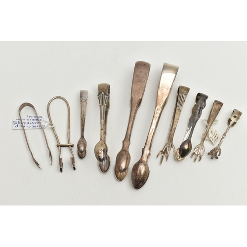 129 - TEN PAIRS OF SUGAR TONGS, to include two large sized fiddle pattern tongs, and eight smaller tongs o... 