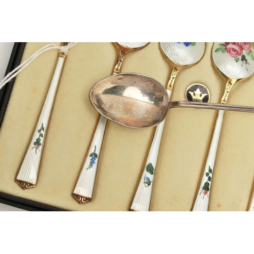 135 - A BOXED SET OF SIX NORWEGIAN SILVER GILT AND ENAMEL COFFEE SPOONS, the back of each bowl and handle ... 