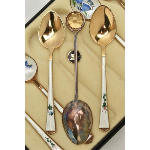 135 - A BOXED SET OF SIX NORWEGIAN SILVER GILT AND ENAMEL COFFEE SPOONS, the back of each bowl and handle ... 