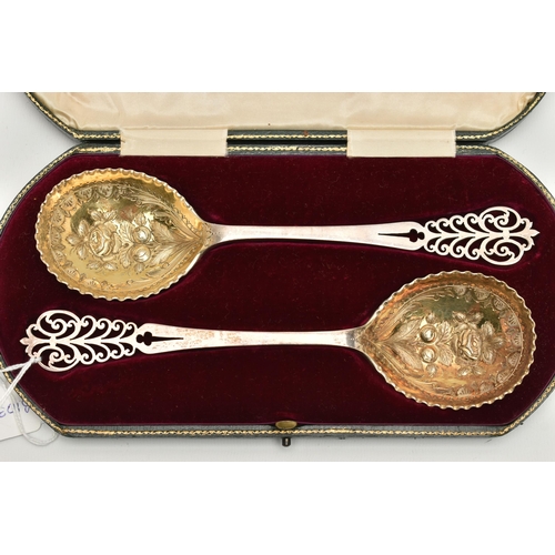 143 - A CASED PAIR OF EDWARDIAN ELKINGTON & CO SILVER FRUIT SPOONS, gilt circular bowls chased and repouss... 