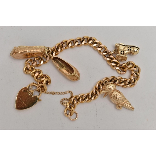 91 - A 9CT GOLD CHARM BRACELET, yellow gold curb link bracelet, fitted with a heart padlock clasp, also f... 