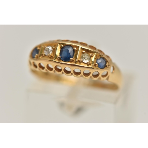 94 - AN EARLY 20TH CENTURY 18CT GOLD BOAT RING, set with three circular cut blue sapphires interspaced wi... 