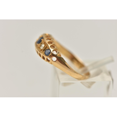 94 - AN EARLY 20TH CENTURY 18CT GOLD BOAT RING, set with three circular cut blue sapphires interspaced wi... 