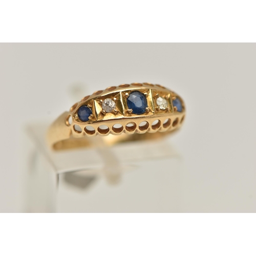 94 - AN EARLY 20TH CENTURY 18CT GOLD BOAT RING, set with three circular cut blue sapphires interspaced wi... 