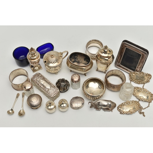 150 - AN ASSORTED BOX OF SILVER ITEMS, to include three napkin rings, salt and pepper shakers, three decan... 