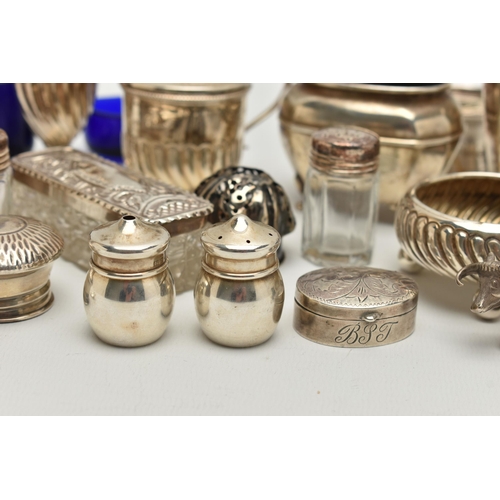 150 - AN ASSORTED BOX OF SILVER ITEMS, to include three napkin rings, salt and pepper shakers, three decan... 