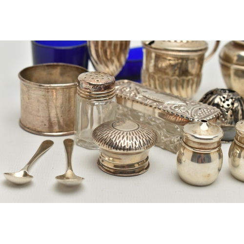 150 - AN ASSORTED BOX OF SILVER ITEMS, to include three napkin rings, salt and pepper shakers, three decan... 