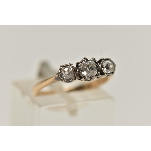 153 - A THREE STONE DIAMOND RING, three old cut diamonds, set in white metal, leading on to a yellow metal... 