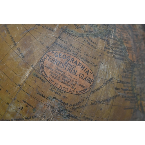 343 - A SMALL 'GEOGRAPHIA' DESK TOP GLOBE,  8 inch terrestrial globe, on an ebonised wooden stand, height ... 