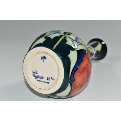 346 - A 1996 MOORCROFT POTTERY  BALUSTER VASE, 'Poppy' pattern on a dark blue ground, designed by Rachel B... 