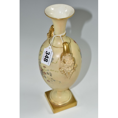 348 - A ROYAL WORCESTER VASE WITH MASK BOSS HANDLES, a collared flared neck vase in a blush ivory ground w... 