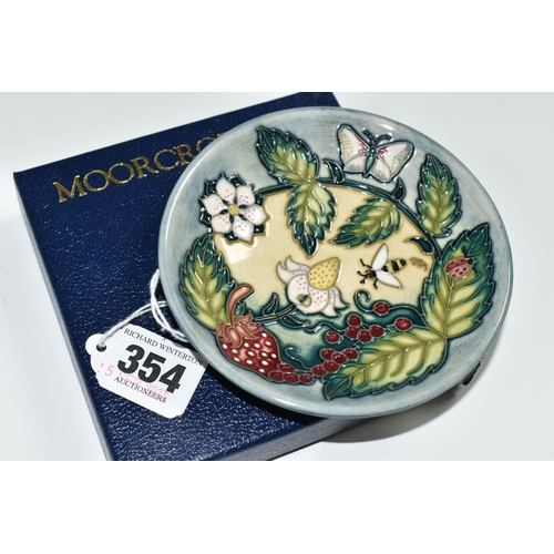 354 - A BOXED MOORCROFT POTTERY 'FRUIT GARDEN' PATTERN TRINKET DISH, impressed and painted marks, gold pen... 