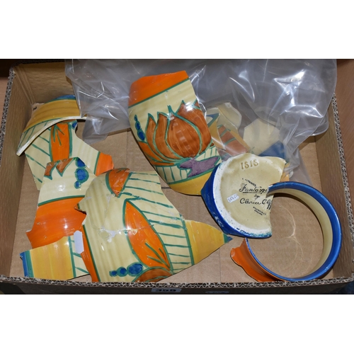 359 - A BOX CONTAINING BROKEN PIECES OF AN ISIS FANTASQUE VASE BY CLARICE CLIFF,  'Lily' pattern, ribbed v... 