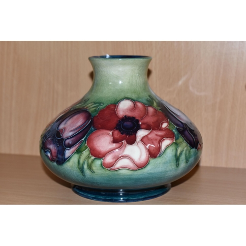 378 - A MOORCROFT POTTERY SQUAT BALUSTER VASE DECORATED WITH PINK AND PURPLE ANEMONES ON A GREEN / BLUE GR... 