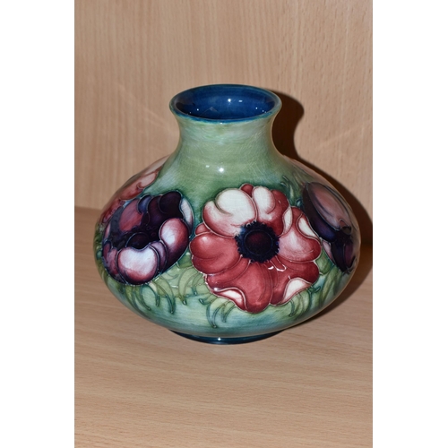 378 - A MOORCROFT POTTERY SQUAT BALUSTER VASE DECORATED WITH PINK AND PURPLE ANEMONES ON A GREEN / BLUE GR... 