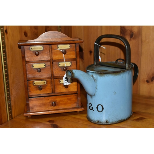 389 - A SMALL SPICE CABINET AND A BLUE ENAMEL HOT WATER POT, comprising a seven drawer spice cabinet, six ... 